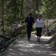 Lisette Oropesa and Nolan Kehler walk in Banff for an interview
