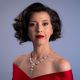 Lisette Oropesa in a red off-shoulder gown and pearl necklace, photo by Steven Harris